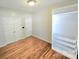 Bedroom with hardwood floors, double door closet and a window that provides natural light at 2226 Elendil Ln, Charlotte, NC 28269