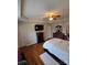 Cozy bedroom with hardwood floors, ceiling fan and dark wood furnishings at 2226 Elendil Ln, Charlotte, NC 28269