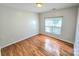 Bright bedroom with hardwood floors and a window that provides natural light at 2226 Elendil Ln, Charlotte, NC 28269