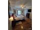 Comfortable bedroom with hardwood floors, ceiling fan, and bright natural light at 2226 Elendil Ln, Charlotte, NC 28269