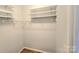 Walk-in closet with multiple shelves and hanging racks, suitable for optimal storage and organization at 2226 Elendil Ln, Charlotte, NC 28269