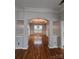 Elegant dining room showcasing hardwood floors, tray ceiling, wainscoting, and a decorative chandelier at 2226 Elendil Ln, Charlotte, NC 28269