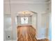 Formal dining room features hardwood floors, modern chandelier and decorative wainscoting at 2226 Elendil Ln, Charlotte, NC 28269