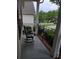 Inviting front porch with rocking chair, iron railing, and a view of the neighborhood at 2226 Elendil Ln, Charlotte, NC 28269