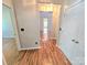 Inviting hallway with hardwood floors and neutral walls at 2226 Elendil Ln, Charlotte, NC 28269