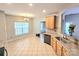 Open concept kitchen with granite countertops, stainless steel appliances, and adjacent breakfast nook at 2226 Elendil Ln, Charlotte, NC 28269