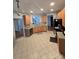 Open kitchen layout with tile floors, wooden cabinets, and a view into other rooms at 2226 Elendil Ln, Charlotte, NC 28269