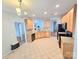 Open concept kitchen featuring stainless appliances, granite countertops, and tile flooring at 2226 Elendil Ln, Charlotte, NC 28269