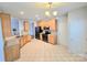 Spacious kitchen with stainless steel appliances, granite countertops, tile flooring, and wood cabinets for storage at 2226 Elendil Ln, Charlotte, NC 28269