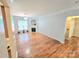 Bright living room with hardwood floors, fireplace, and seamless flow into other rooms at 2226 Elendil Ln, Charlotte, NC 28269