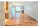 Expansive living room boasts hardwood floors, a fireplace, and bright neutral paint at 2226 Elendil Ln, Charlotte, NC 28269