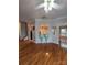 View of the Living Room with Hardwood floors and open concept to the kitchen and entrance at 2226 Elendil Ln, Charlotte, NC 28269