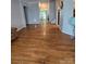 The open-plan living area features shining hardwood flooring and neutral walls at 2226 Elendil Ln, Charlotte, NC 28269