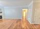 Spacious living room featuring hardwood floors, a fireplace, and white trim at 2226 Elendil Ln, Charlotte, NC 28269
