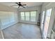 Bright living room with large windows, a ceiling fan, and neutral paint at 2226 Elendil Ln, Charlotte, NC 28269