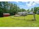 Home exterior with pool, shed, and fence surrounded by a lush green yard at 231 Valley View Dr, Clover, SC 29710