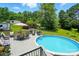 Outdoor swimming pool with surrounding deck and backyard dining set at 231 Valley View Dr, Clover, SC 29710