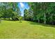 Expansive backyard featuring lush green grass and mature trees at 231 Valley View Dr, Clover, SC 29710