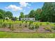 Landscaped front yard and home with blue shutters; additional outbuilding is visible at 231 Valley View Dr, Clover, SC 29710