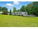 Exterior home view with a well-maintained lawn, blue shutters, and a ramp entrance at 231 Valley View Dr, Clover, SC 29710