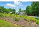 Suburban home nestled among mature trees with landscaping on a sunny day at 231 Valley View Dr, Clover, SC 29710