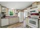 Fully-equipped kitchen with a double sink, a view of the backyard and modern appliances at 231 Valley View Dr, Clover, SC 29710