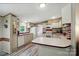 Well-lit kitchen featuring modern appliances, cabinets, and countertops with backsplash at 231 Valley View Dr, Clover, SC 29710