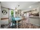 Open kitchen and dining area with ample natural light and wood plank flooring at 231 Valley View Dr, Clover, SC 29710