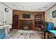 Living room highlighting wood paneling around fireplace, built-ins and luxury vinyl plank floor at 231 Valley View Dr, Clover, SC 29710