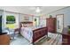 Cozy bedroom with a large bed, ample natural light, ceiling fan and closet space at 231 Valley View Dr, Clover, SC 29710