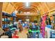 Interior of the outbuilding featuring a riding lawnmower, shelving, and an open storage space at 231 Valley View Dr, Clover, SC 29710