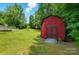 Red storage shed in the backyard at 231 Valley View Dr, Clover, SC 29710