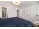 Bedroom featuring three closets and ensuite bathroom with glass enclosed shower at 235 S Bruns Ave, Charlotte, NC 28208