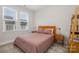 Bedroom with minimalist decor, natural light, and carpet flooring at 235 S Bruns Ave, Charlotte, NC 28208