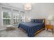 Bedroom showcasing natural light from the windows, and a comfortable bed at 235 S Bruns Ave, Charlotte, NC 28208