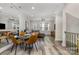 Open-concept living space with a dining table set and views to the living room at 235 S Bruns Ave, Charlotte, NC 28208