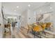 Bright dining area with stylish table, chairs, and view of the open floor plan at 235 S Bruns Ave, Charlotte, NC 28208