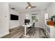 This office features dual monitors, a modern desk, and a ceiling fan at 235 S Bruns Ave, Charlotte, NC 28208
