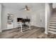 The home office is complete with a stylish desk, shelving and modern ceiling fan at 235 S Bruns Ave, Charlotte, NC 28208