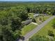 Aerial view of a home with a long driveway on a large lot surrounded by trees at 2451 Robert H Kirk Rd, Lancaster, SC 29720