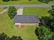 Overhead view of a well-maintained brick home with a new wooden staircase, a driveway and manicured lawns at 2451 Robert H Kirk Rd, Lancaster, SC 29720