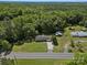 Aerial view of a home with long driveway on a large lot surrounded by lush greenery at 2451 Robert H Kirk Rd, Lancaster, SC 29720