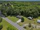 An aerial perspective of a property featuring an extensive green lawn and multiple buildings at 2451 Robert H Kirk Rd, Lancaster, SC 29720