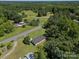 Expansive aerial view of a secluded property surrounded by lush greenery and a charming rural landscape at 2451 Robert H Kirk Rd, Lancaster, SC 29720