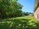 Spacious, green backyard featuring additional outbuildings, perfect for outdoor activities at 2451 Robert H Kirk Rd, Lancaster, SC 29720