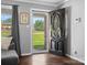 Inviting home foyer with hardwood floors, modern gray walls, and a view of the lush green front yard at 2451 Robert H Kirk Rd, Lancaster, SC 29720