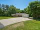 Charming brick home features a paved driveway and an attached single-car garage at 2451 Robert H Kirk Rd, Lancaster, SC 29720