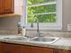 A close-up shot of a stainless steel kitchen sink with a window view at 2451 Robert H Kirk Rd, Lancaster, SC 29720