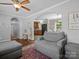 Cozy living room with hardwood floors, comfortable gray seating, and an open view to the dining area and kitchen at 2451 Robert H Kirk Rd, Lancaster, SC 29720