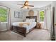 A bedroom with a bed, ceiling fan, and large windows at 2451 Robert H Kirk Rd, Lancaster, SC 29720